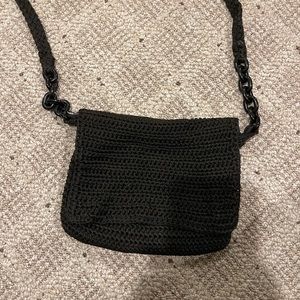 Black knitted crossbody purse with chain accents